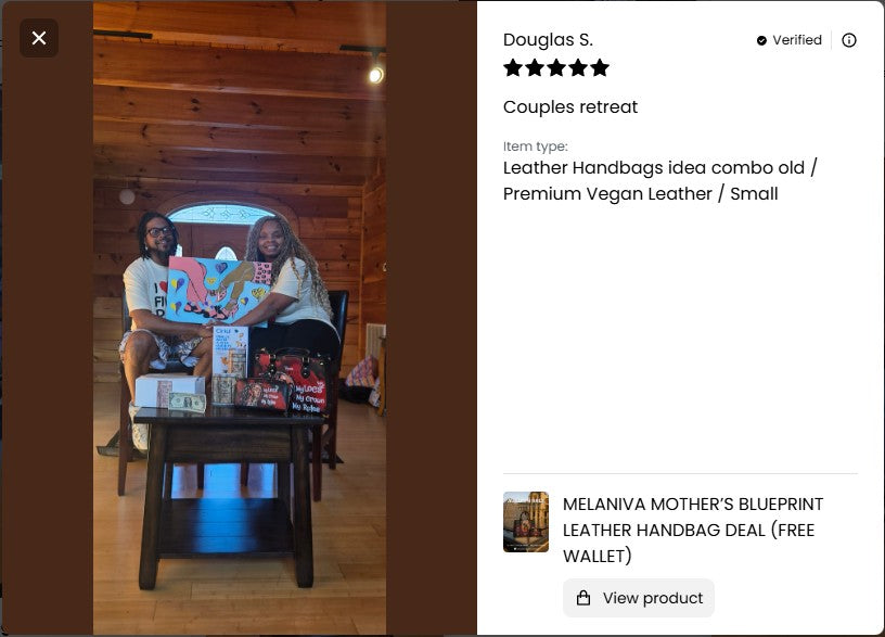 Two people sitting on a wooden floor with a table displaying leather handbags, with a product listing on the right side.
